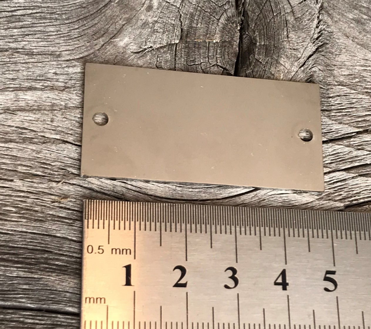 Merkeskilt 50x25x1 mm 316 matt stål