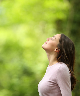 Adult woman outdoors, reflecting on emotions — Therapy for Depression for women Calgary