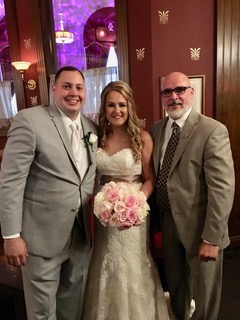 Sal Fiore wears a gray suit to his wedding ceremony