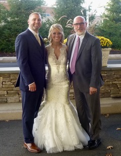 Justice of the Peace Sal Fiore from Enfield, CT stands with his couple after their ceremony.