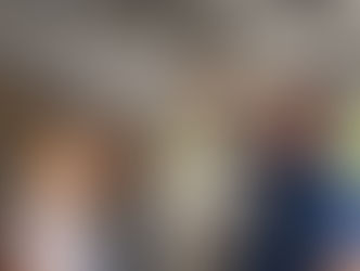 Garage door opener repair technician inspecting broken garage door