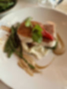 A plate with food artfully displayed.