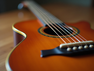 Beginner guitarist improvising lead lines on electric guitar with accompanying scale charts and fretboard diagrams showing pentatonic patterns and simple soloing concepts for improvisation practice.