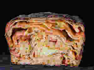Scaccia A street food popular in its native Ragusa, scaccia is an exercise in rustic simplicity: A pizza-style dough is rolled super-thin, smeared with tomato sauce, showered with D.O.P. caciocavallo cheese, and folded into a lasagna-like loaf.