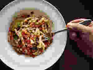 Corkscrew Pasta with Eggplant and Tomato-Basil Pesto (Busiate con Pesto alla Trapanese) The North African tradition of serving almonds in savory dishes is reflected in the pesto for this dish, in which the nuts are mixed with tomatoes and basil and tossed with busiate, the traditional corkscrew-shaped pasta from Trapani.