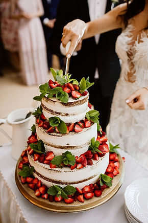 London wedding photography, newlyweds cake cutting, strawberry cake, naked cake