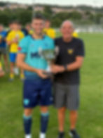Bill Robson presents the trophy to Ceiran Casson.
