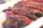Sliced steak on a white plate