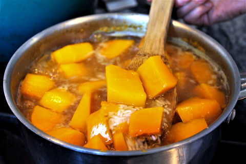 Chunks of pumpkin boiling in a pot