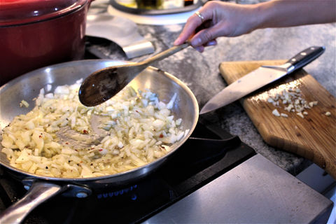 Sautéing onions in a pan