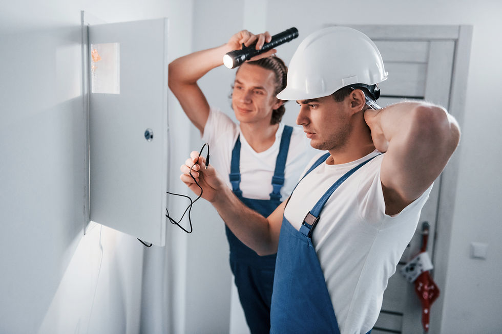 vecteezy_two-young-male-electricians-works-indoors-together-using_15362396.jpg