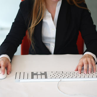 Professional female typing at a computer