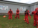 Chippewa/Ottawa commercial fishermen practicing with immersions suits in Naubinway, Upper Peninsula, MIchigan in AMSEA Drill Conductor workshop held in the Top of the World Snowmobile museum meeting room.