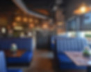 Modern restaurant interior with blue booths
