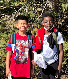 Two boys hiking in the woods