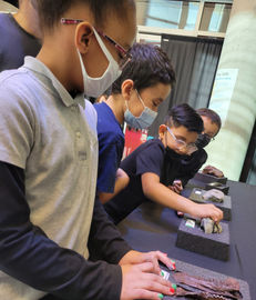 Students examining ancient artifacts