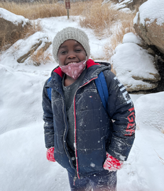 Smiling boy in winter snow