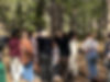 Students huddle together outdoors, enjoying school culture at axlacademy