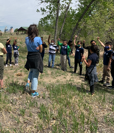 Kids and teachers playing outdoors at axlacademy