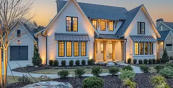 Apex Homes Florida custom-built modern home exterior with large windows and stone accents