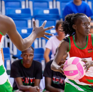 A Kenyan netballer plays netball in Singapore
