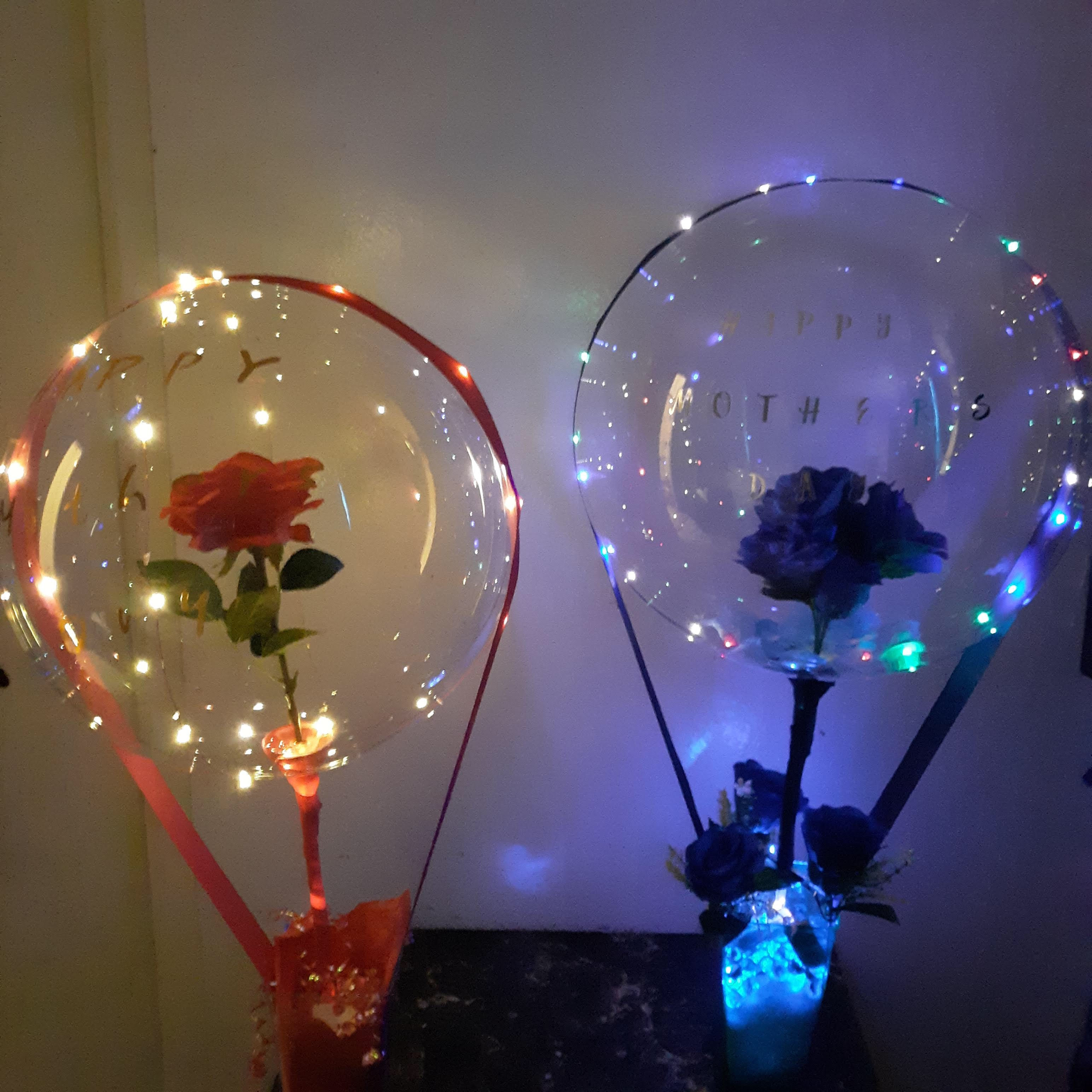 Bobo balloons with take flowers inside