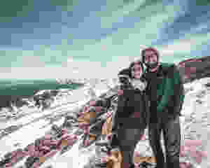 Steph and Scott from Each Day Slow take a picture at the top of Mt. Evans in Colorado celebrating one year of marriage.
