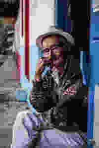 Man sitting in doorway in Jardin, Colombia.