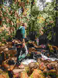 Hiking across rivers in Jardin, Colombia.