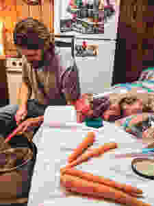 Peeling carrots while prepping for crockpot freezer meals.