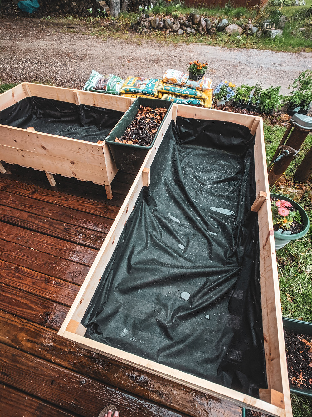 The finished DIY raised garden beds perfect for a small space in Northern Michigan. They were designed by Steph Castelein from the Each Day Slow blog.