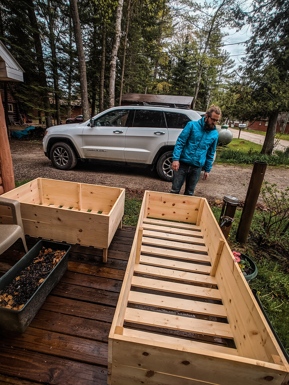Deciding where to put our DIY raised garden beds made by Steph Castelein at Each Day Slow in Northern Michigan.