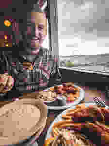 Eating fish and chips at the Athenian at Pike Place Market in Seattle, Washington during our road trip to the PNW.