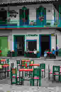 People sitting in the main square in Jardin, Colombia.
