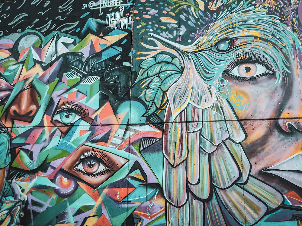 Colorful graffiti mural in Comuna 13 in Medellín, Colombia.