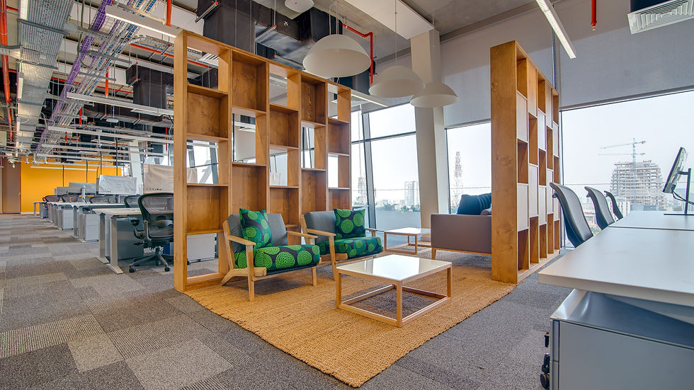 Open-plan office neighbourhood featuring individual workstations alongside shared areas where employees connect, collaborate, and exchange ideas. | Designed by Spacefinish