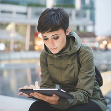 Young Woman Reading Tablet