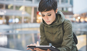Young Woman Reading Tablet