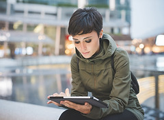 Young Woman Reading Tablet
