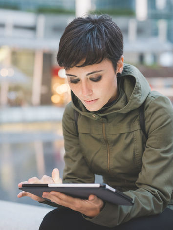 Young Woman Reading Tablet
