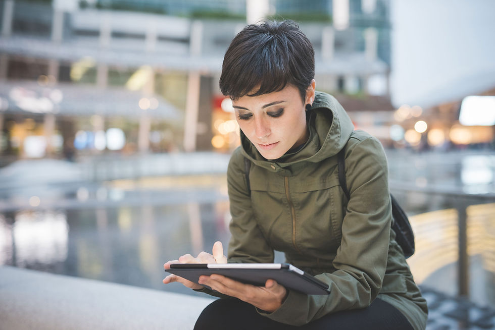 A Young Woman Reading on Tablet