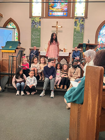 Kids on altar with Mary.JPEG