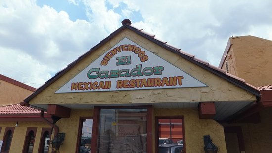 Close-up view of a colorful plate of tacos at El Cazador