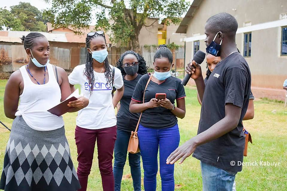 Savio Dominic Nkuubi meeting with four females in Kampala Uganda