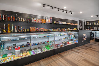 Store photo of head shop including bongs, grinders, trays, and more