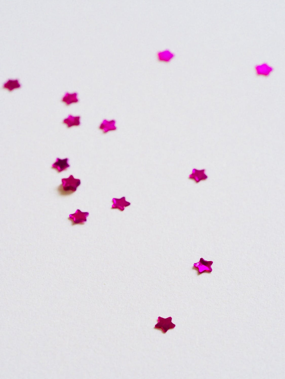 pink stars on white background