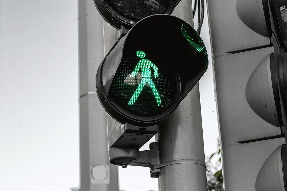green walk signal on black traffic light