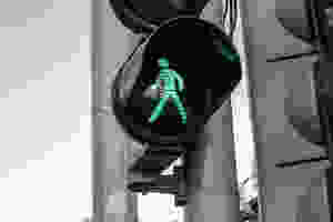 green walk signal on black traffic light