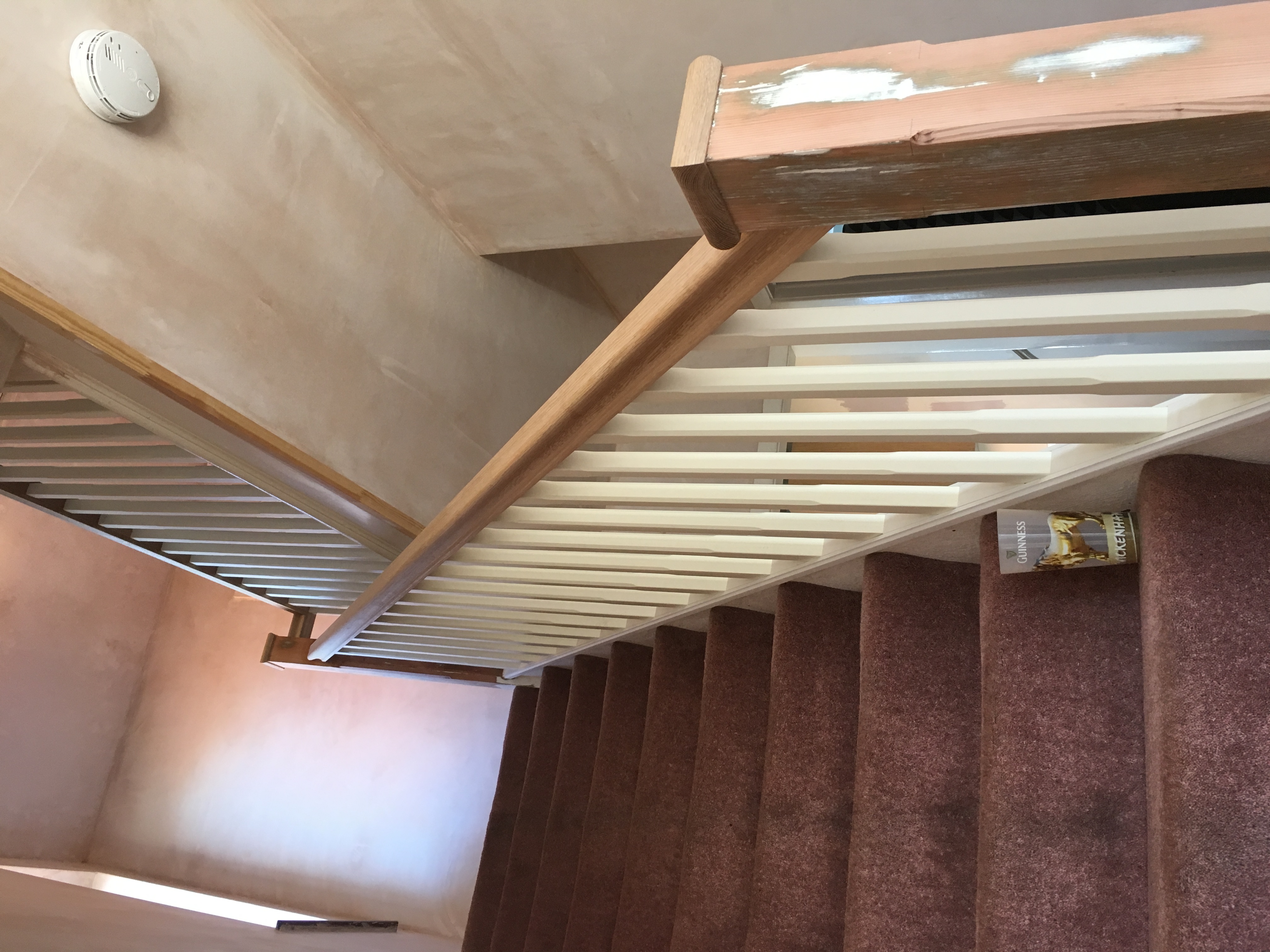 Oak handrail and caps with primed stop-chamfered spindles and baserail