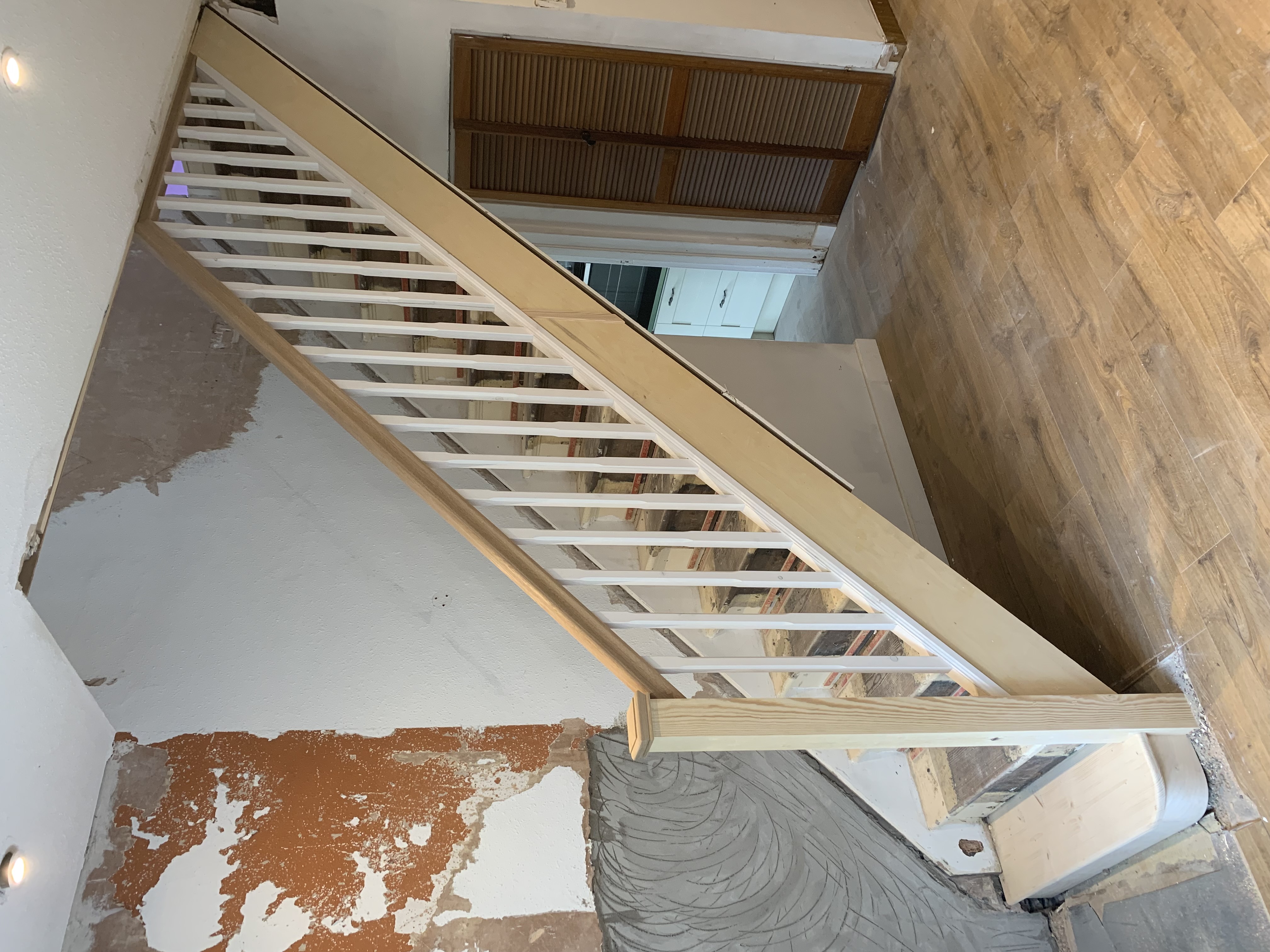 Oak handrail with primed stop-chamfered spindles and baserail
